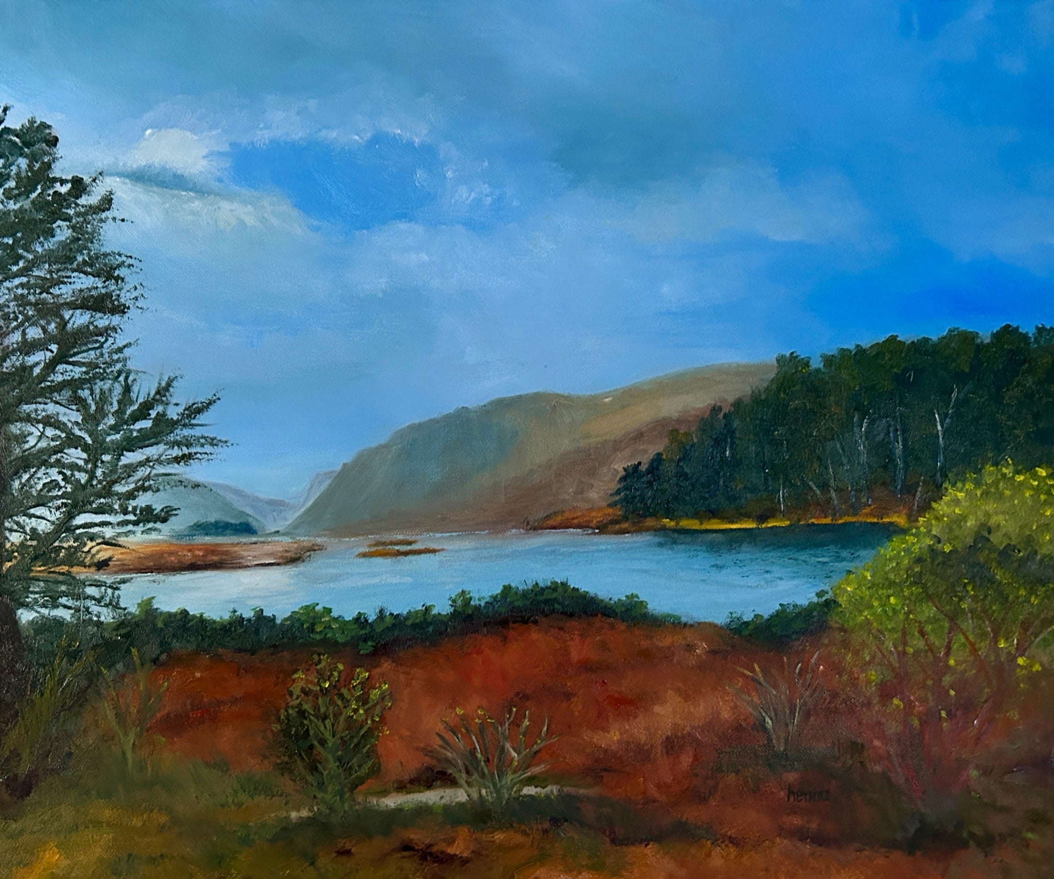 Landscape painting of a scenic lake or river winding between green hills and trees under a blue sky, with reddish-brown foreground terrain and shrubs.