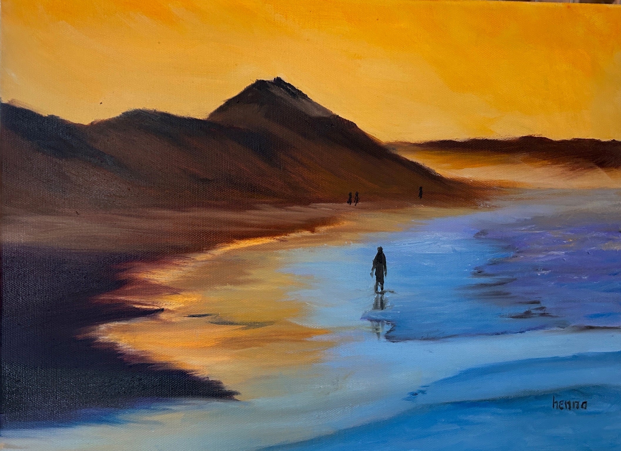 A landscape painting of a beach or salt flat at sunset, with dark mountains in the background, a glowing orange sky, reflective blue water, and a small silhouetted figure standing in the shallow water near the center.