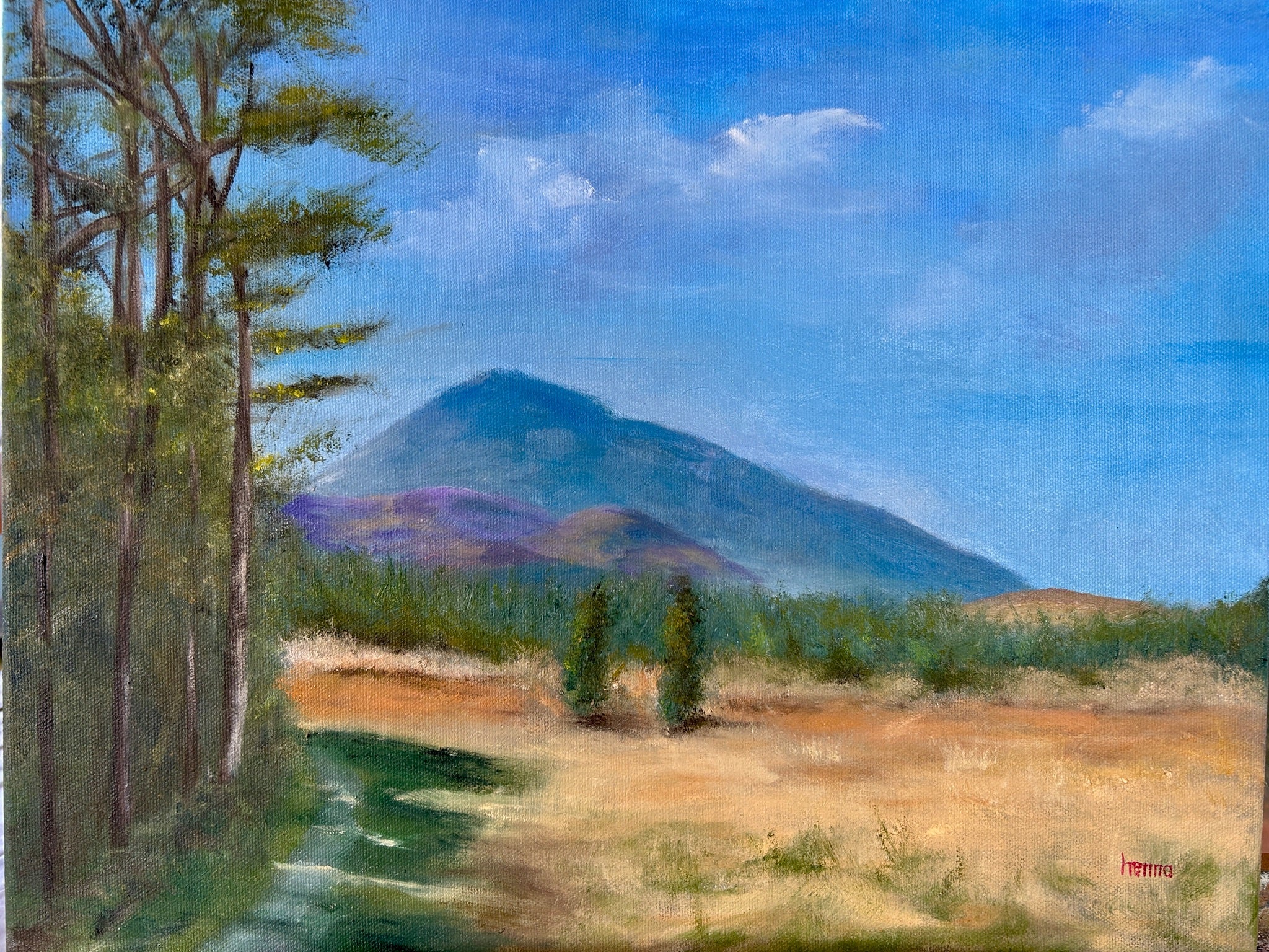 A landscape painting depicting a mountain under a blue sky, with a path through green trees on the left and dry grassy fields in the foreground.