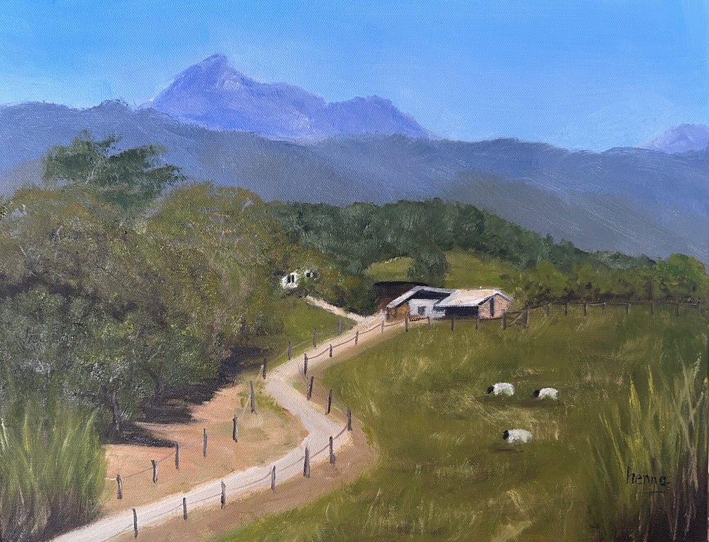 A landscape painting depicting a rural scene with a winding dirt road, a small house, grazing sheep, green fields, trees, and blue mountains under a clear blue sky.