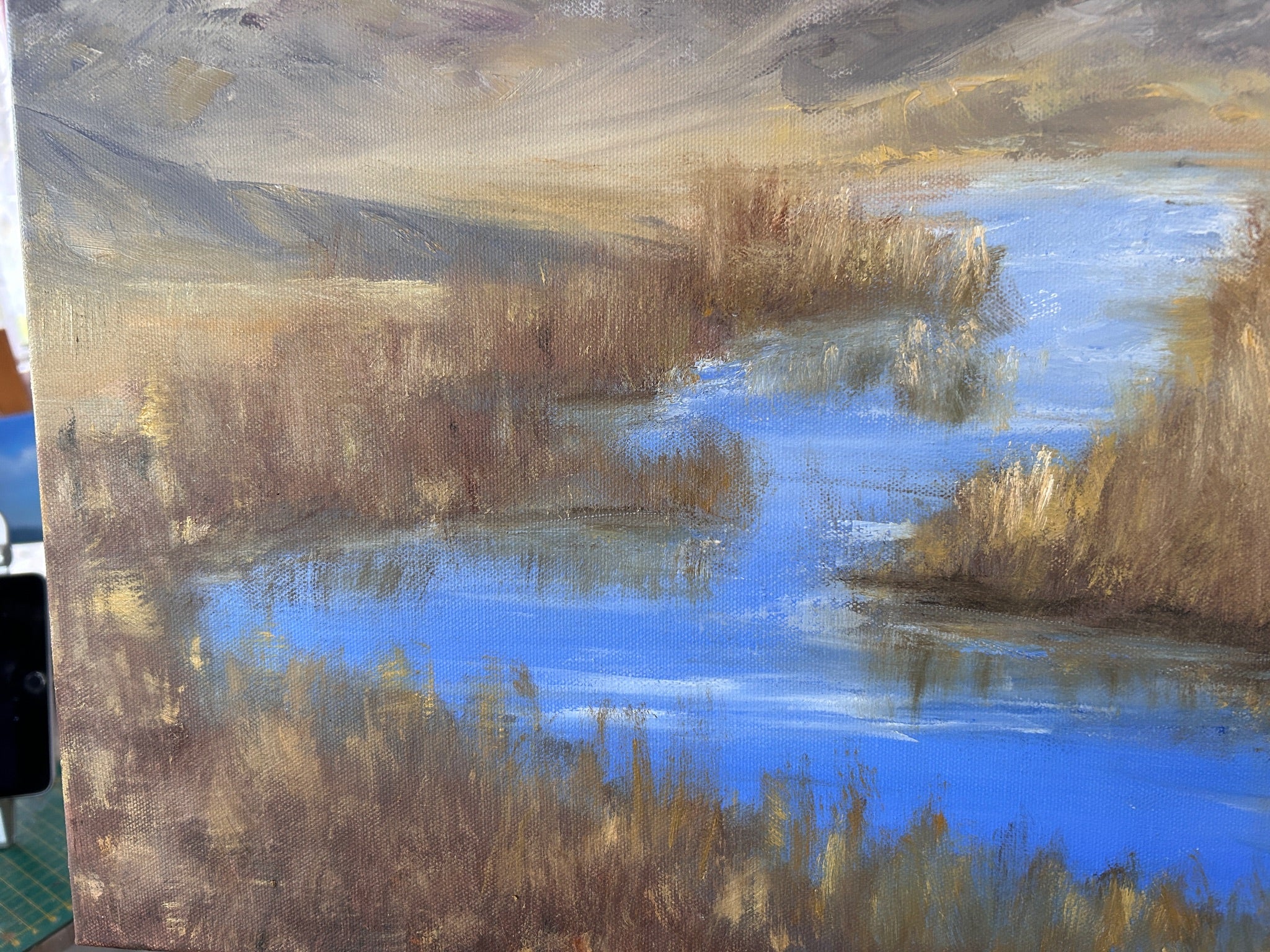 Painting of a landscape with water and reeds